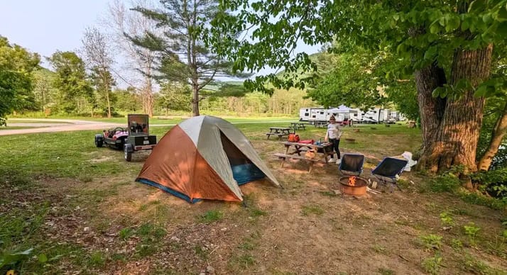 Tent campsite on an open lawn at Squarewood Acres Campground in Trout Run, Pennsylvania